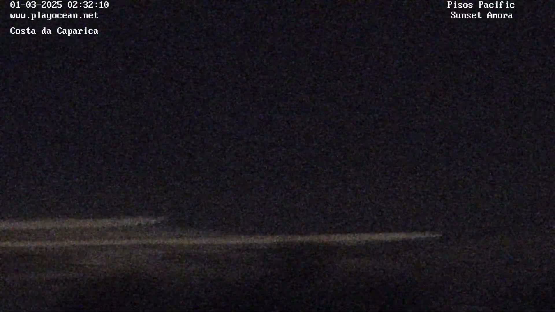 A dark, nighttime scene shows a faint, light-colored horizontal line near the bottom, possibly representing the horizon.