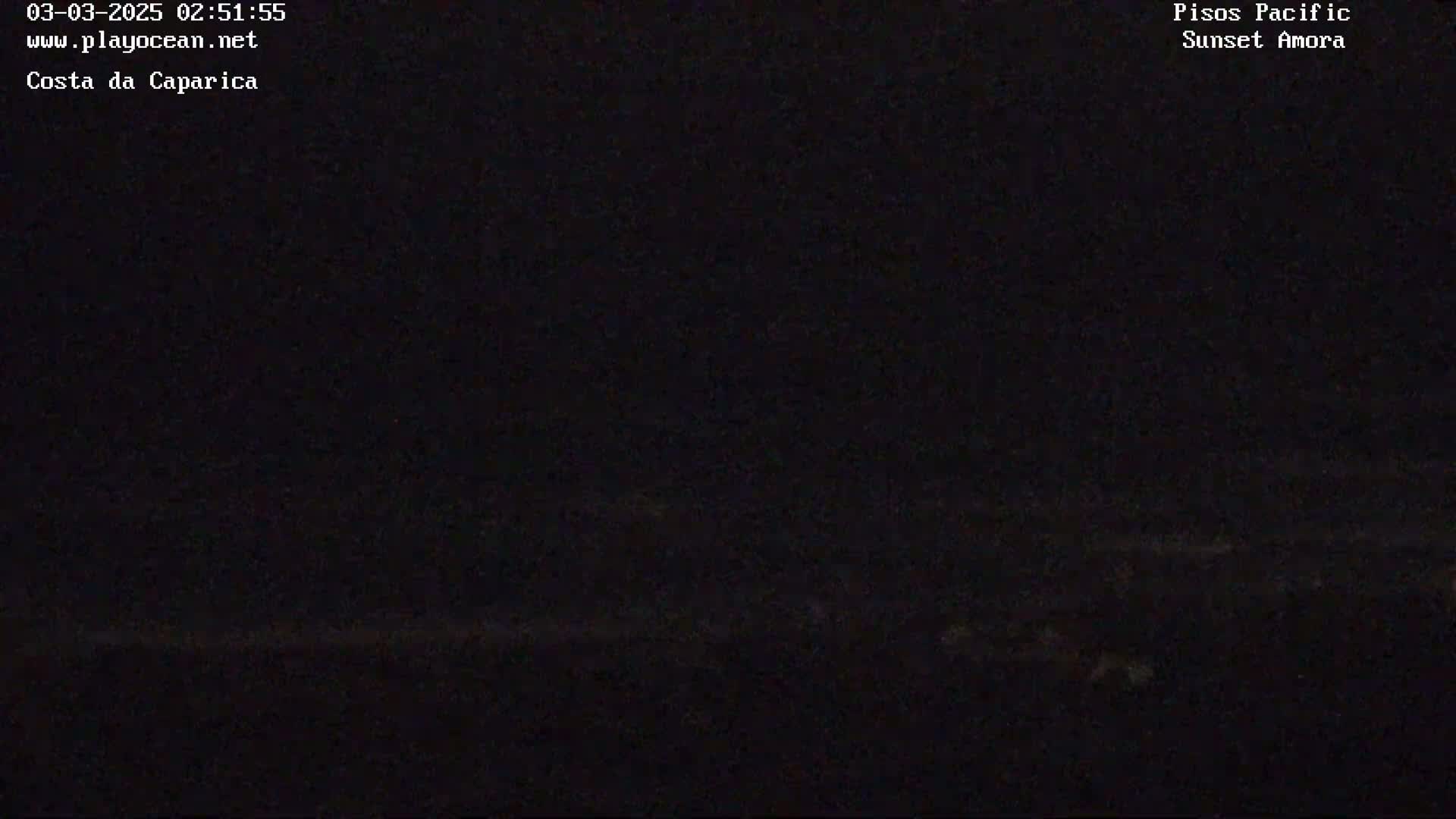 A very dark, nighttime image shows a mostly indiscernible horizon line.