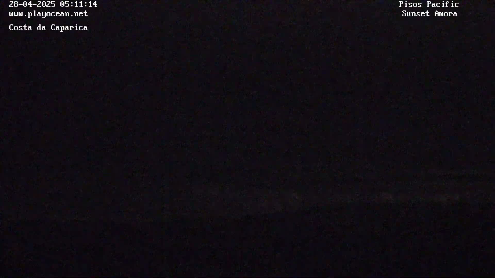A very dark image shows a mostly black scene with a faint, indistinct lighter area at the bottom.
