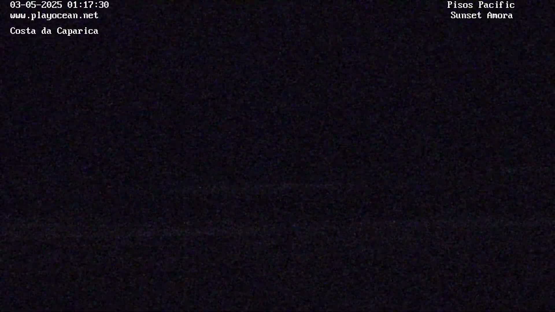 A nighttime image shows a dark, mostly uniform expanse.