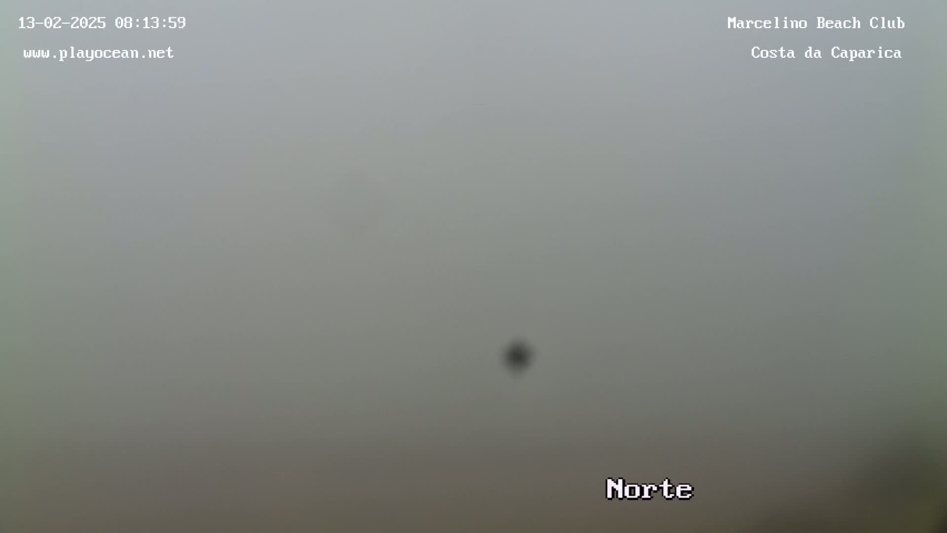 A very foggy or hazy outdoor scene is visible.