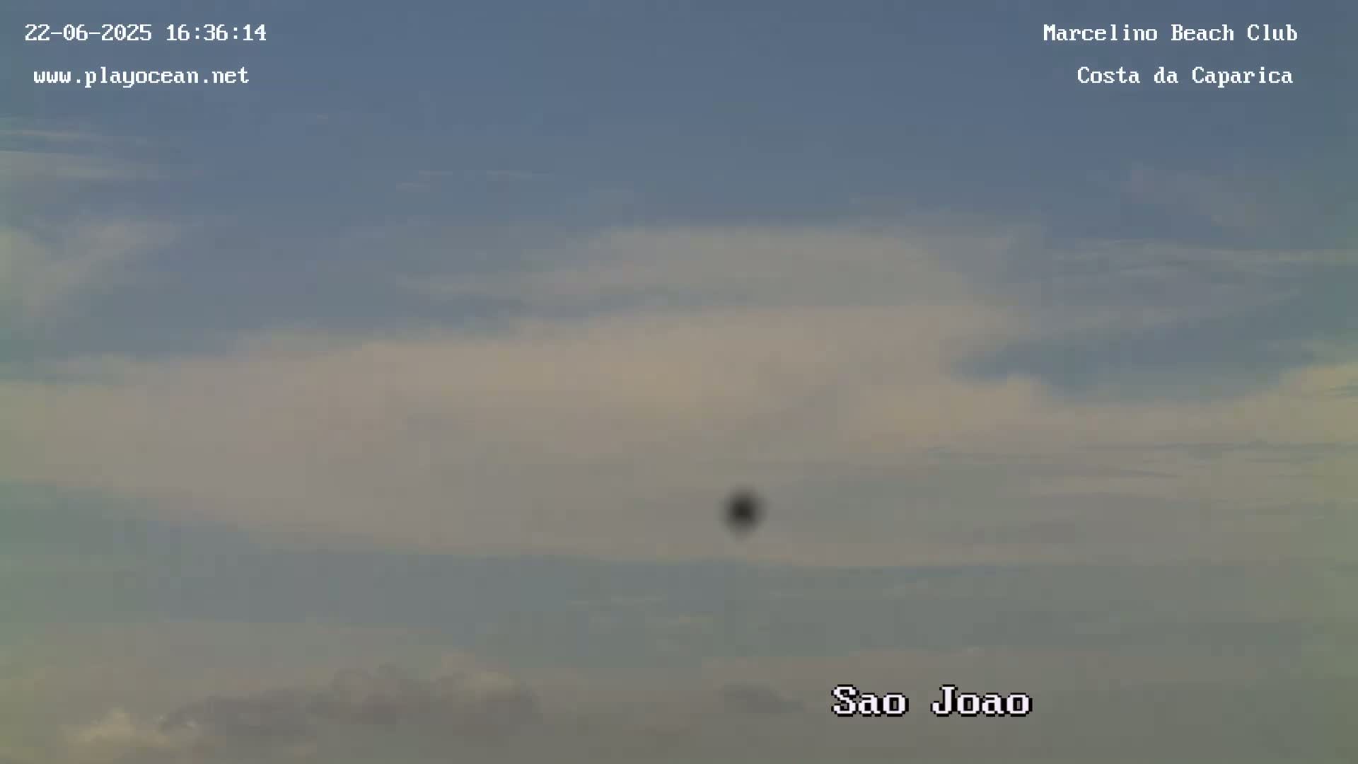 A mostly clear sky with thin, high clouds.