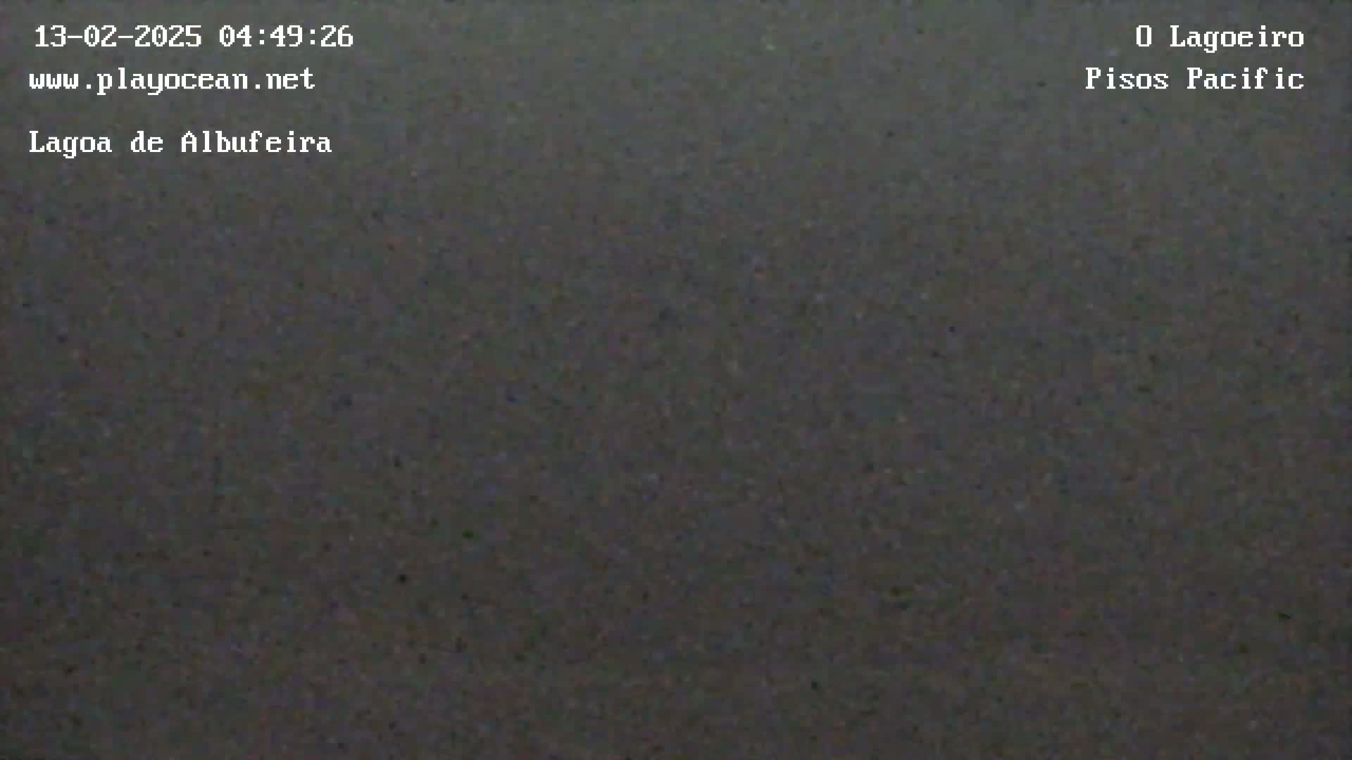 A dark gray, possibly asphalt, surface is shown.