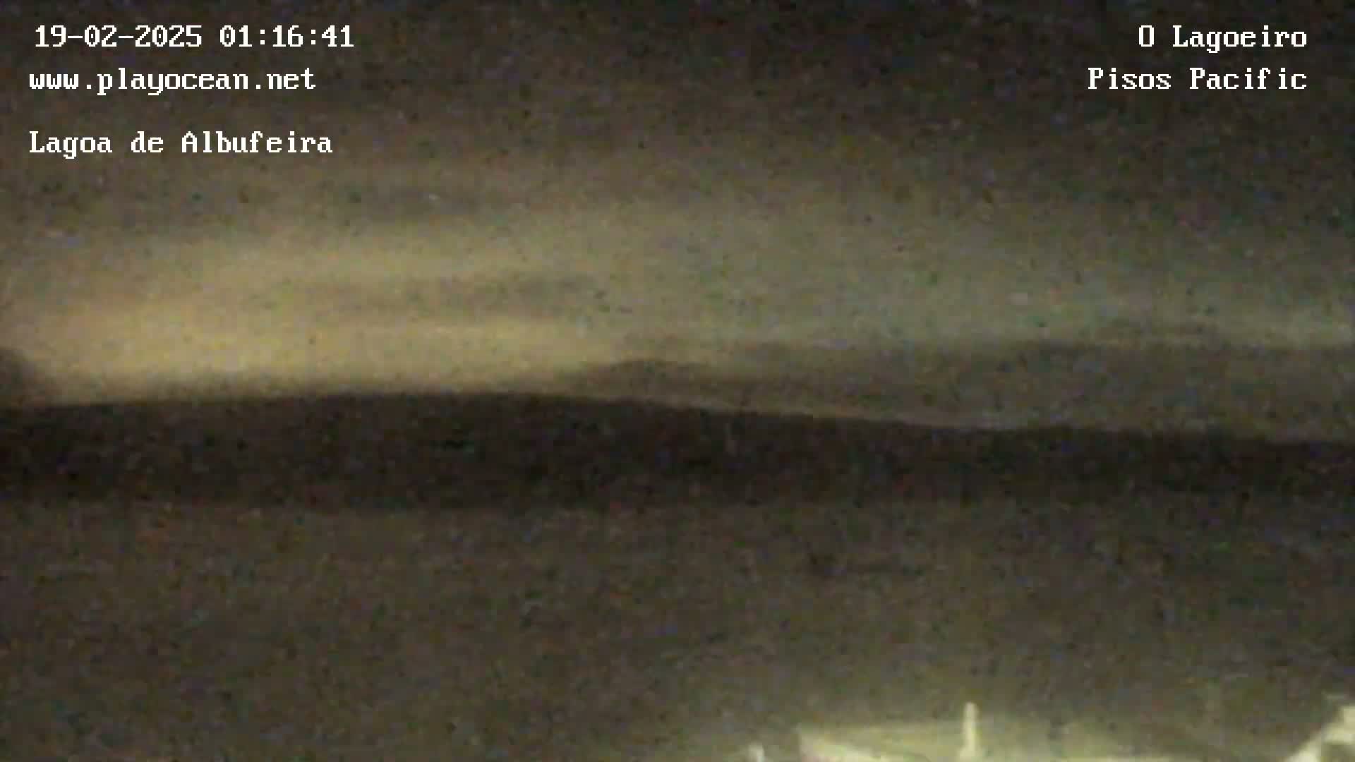 A nighttime long shot shows a dark, flat landscape under a cloudy sky.