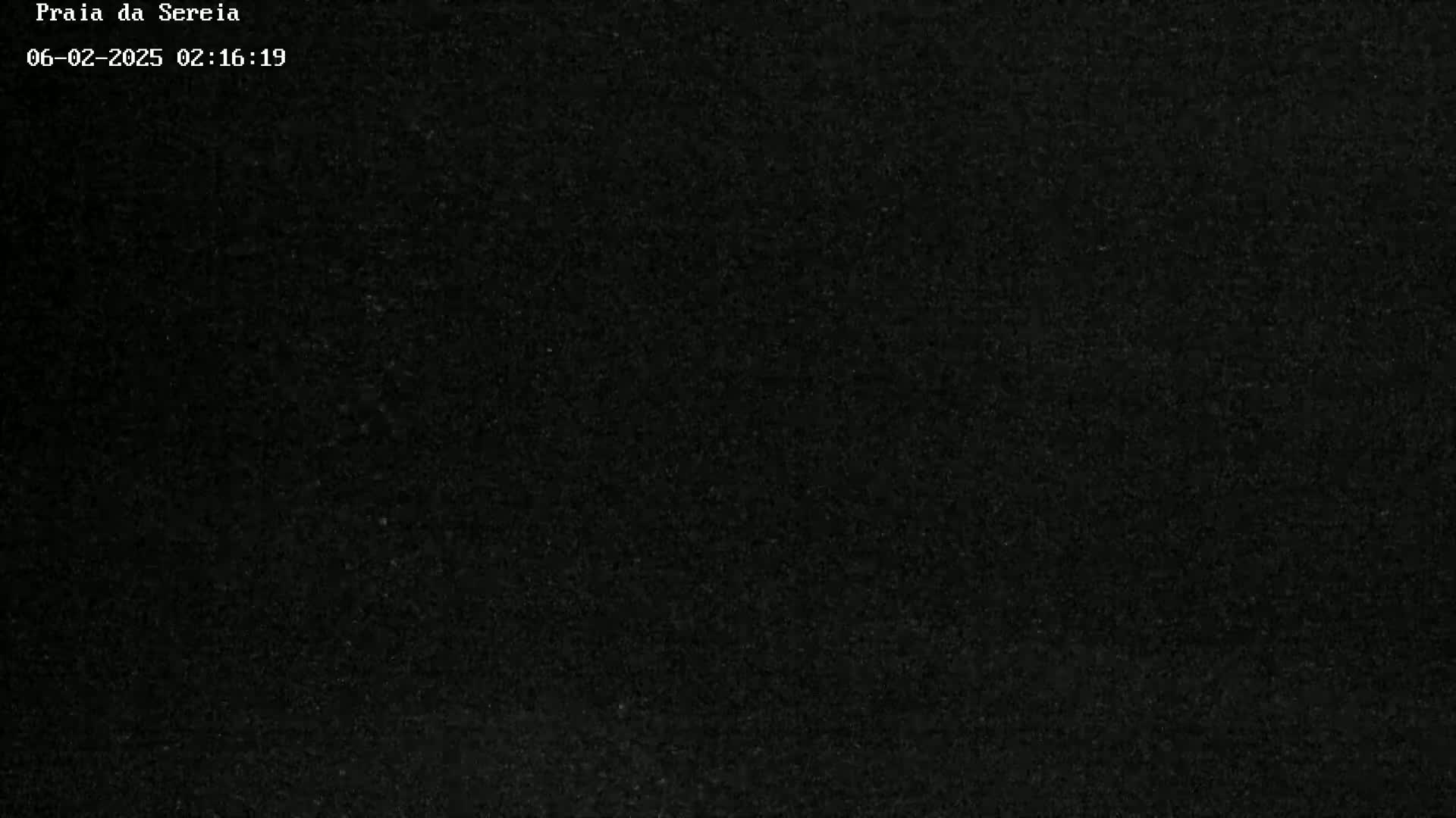 The image shows a completely dark, textured surface.