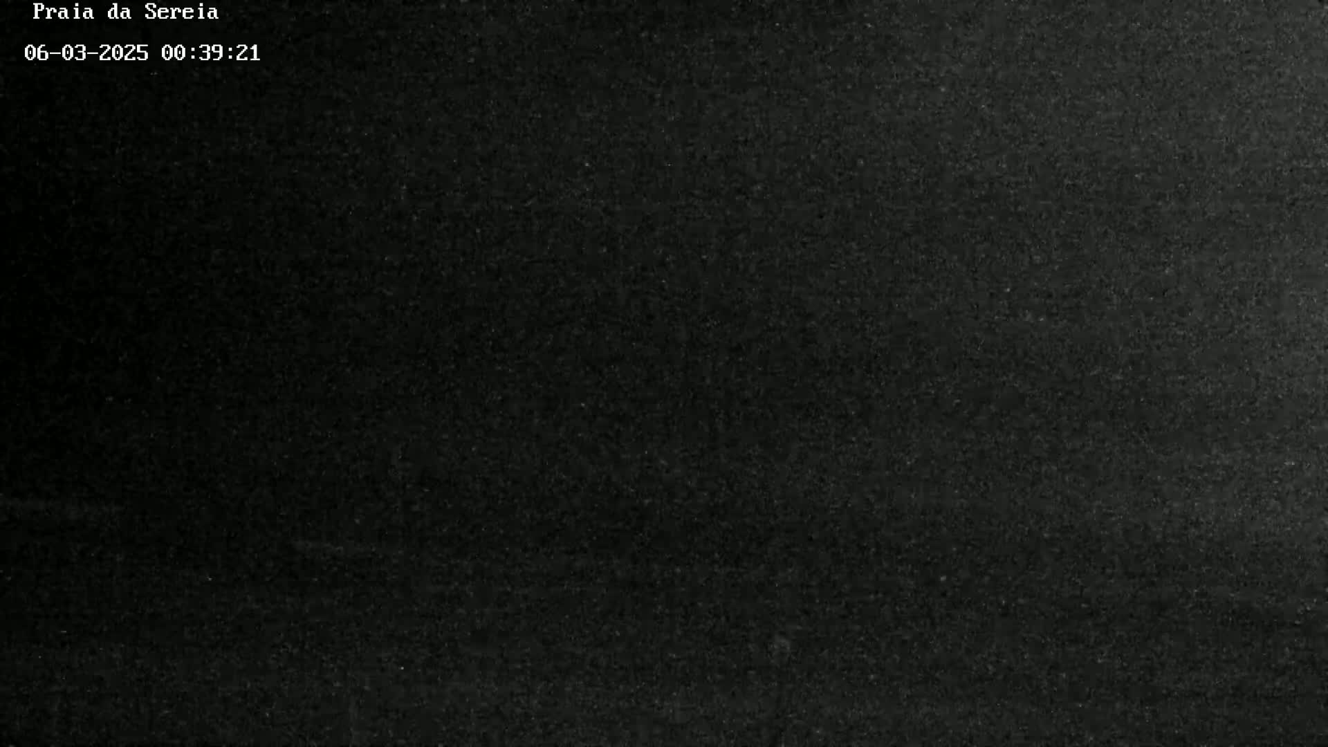 A dark, grainy image shows a uniformly black surface.