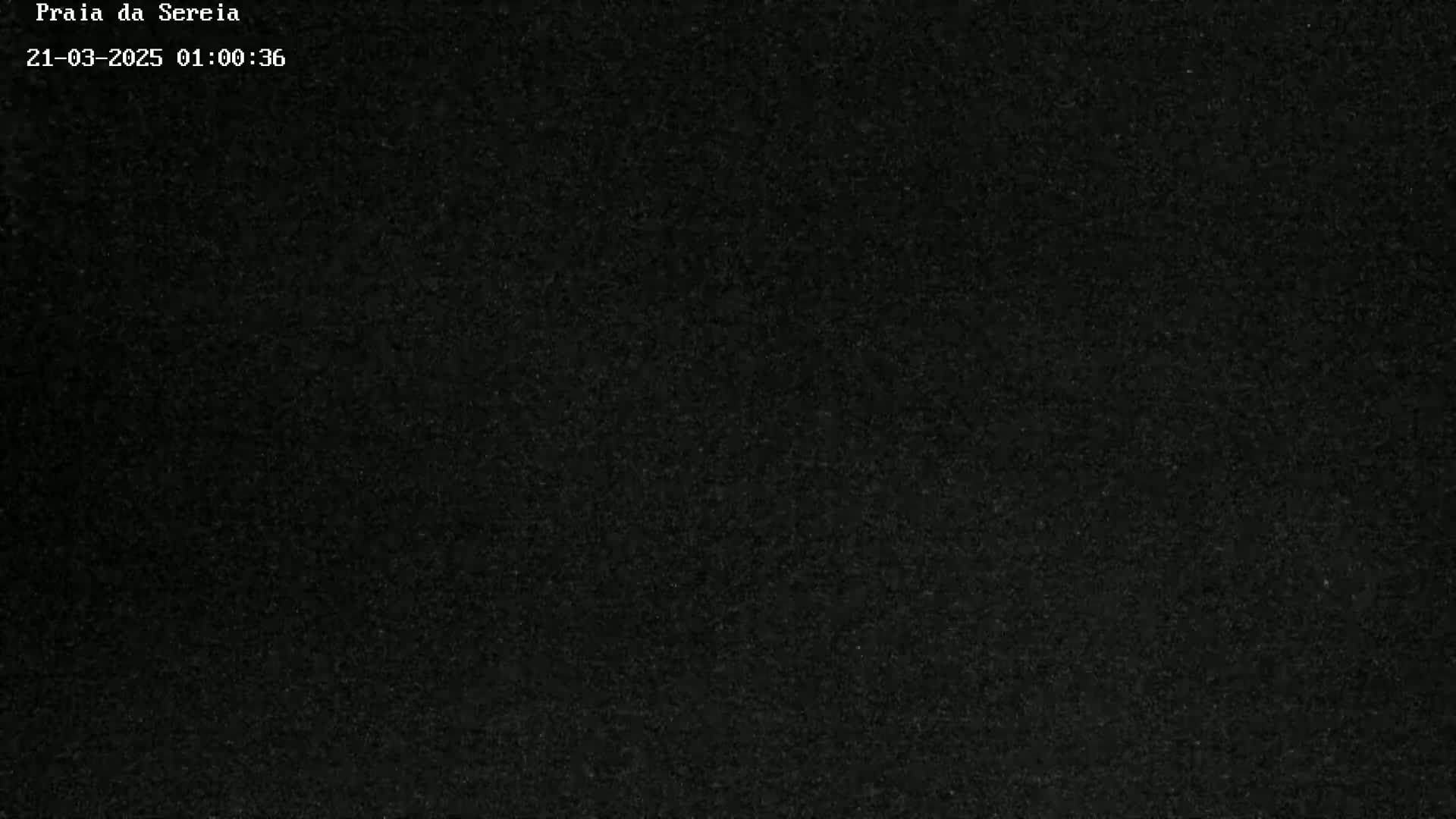A completely dark image, possibly depicting nighttime conditions.