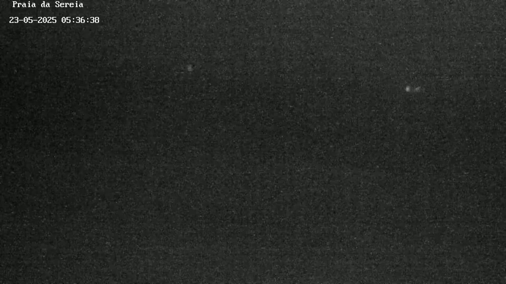 A dark gray or black textured surface is shown.