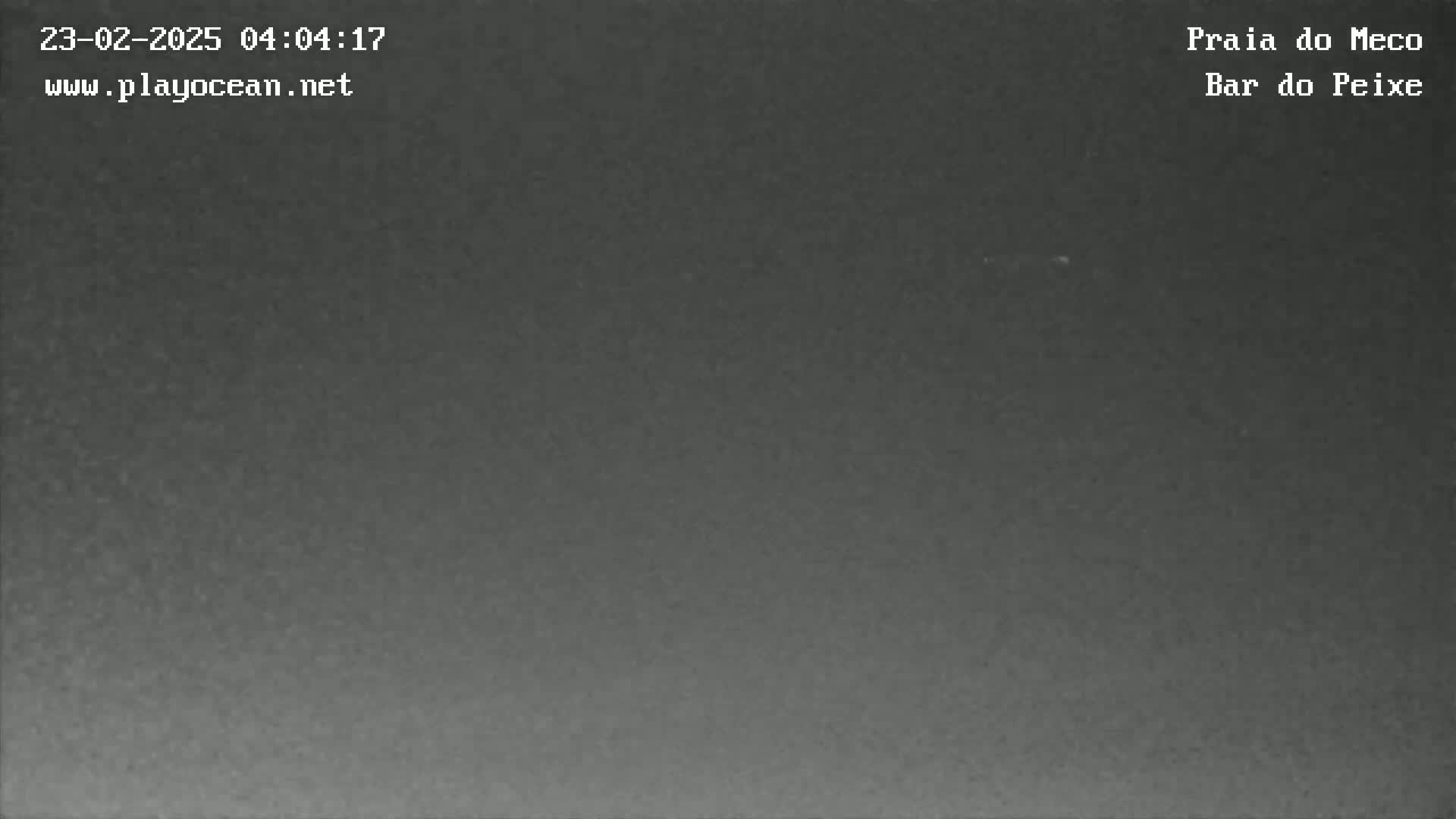 A dark, nighttime image shows a mostly uniform gray sky.