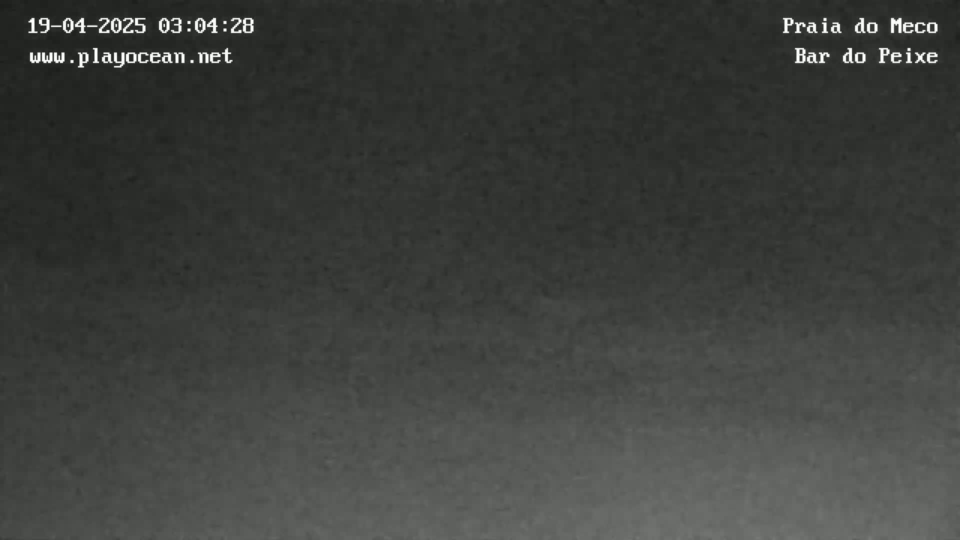 A dark gray, possibly nighttime image shows a uniformly colored surface.