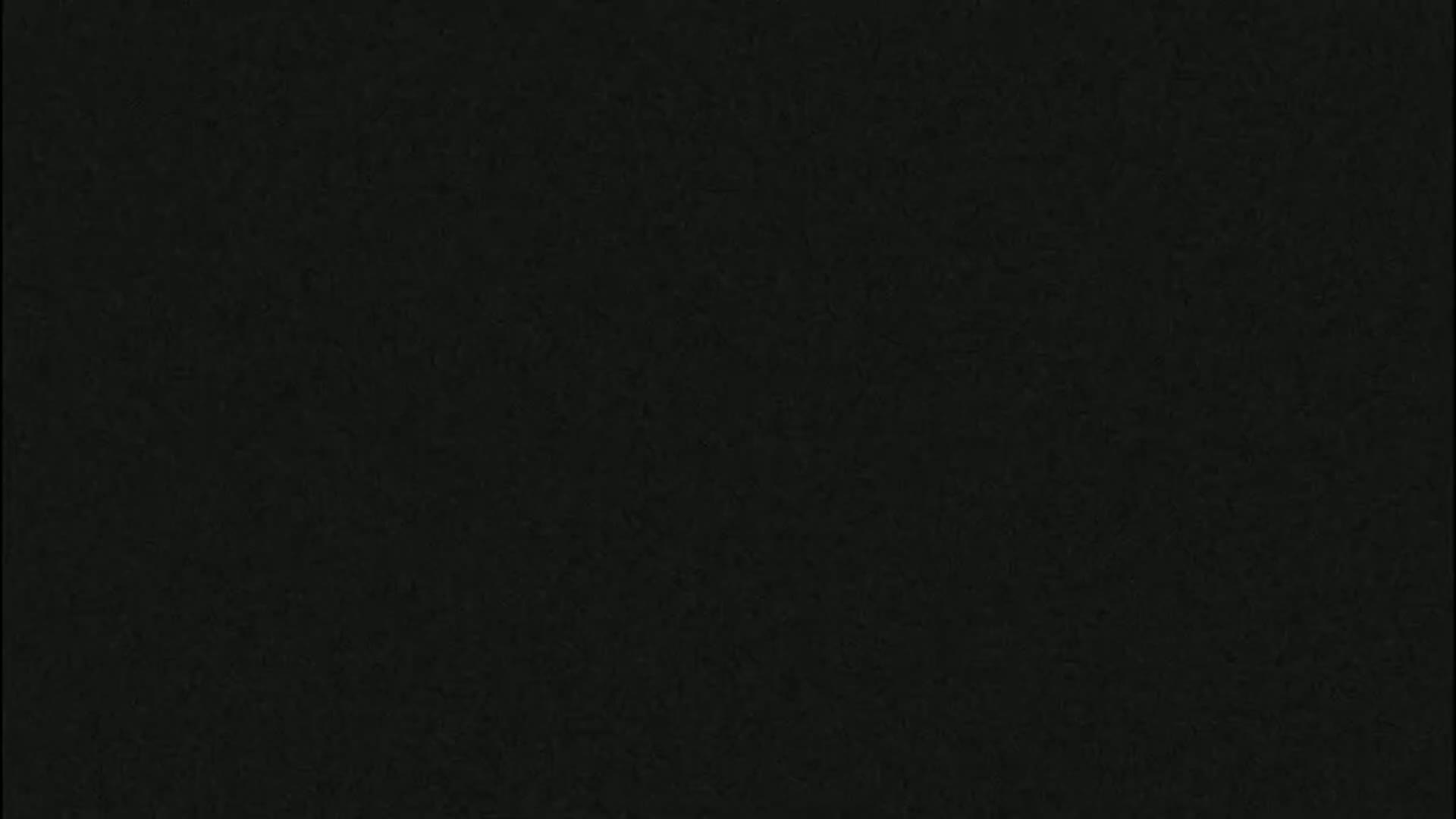 The image shows a dark, textured surface.