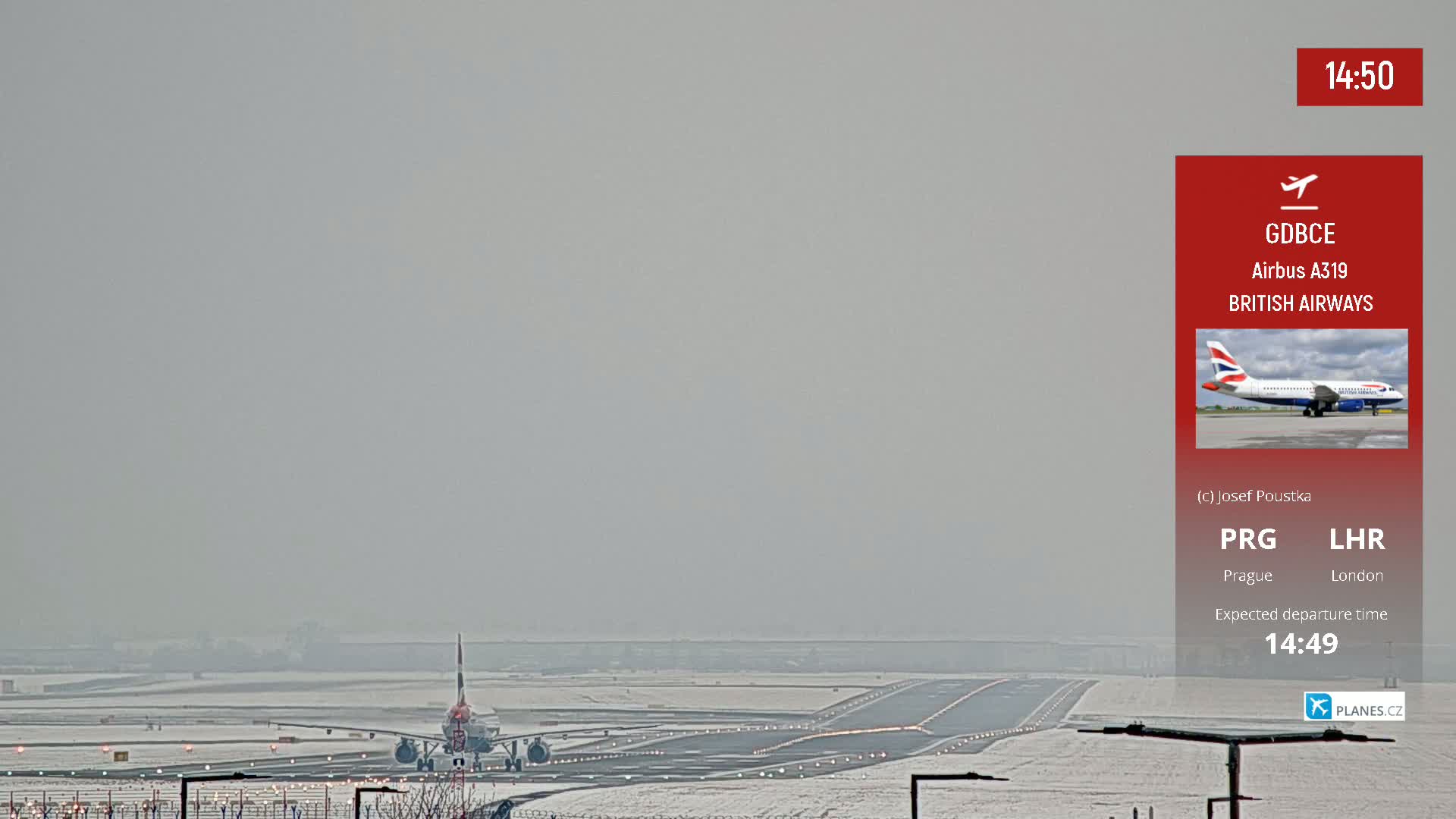 A British Airways Airbus A319 sits on a snow-covered runway on an overcast day.