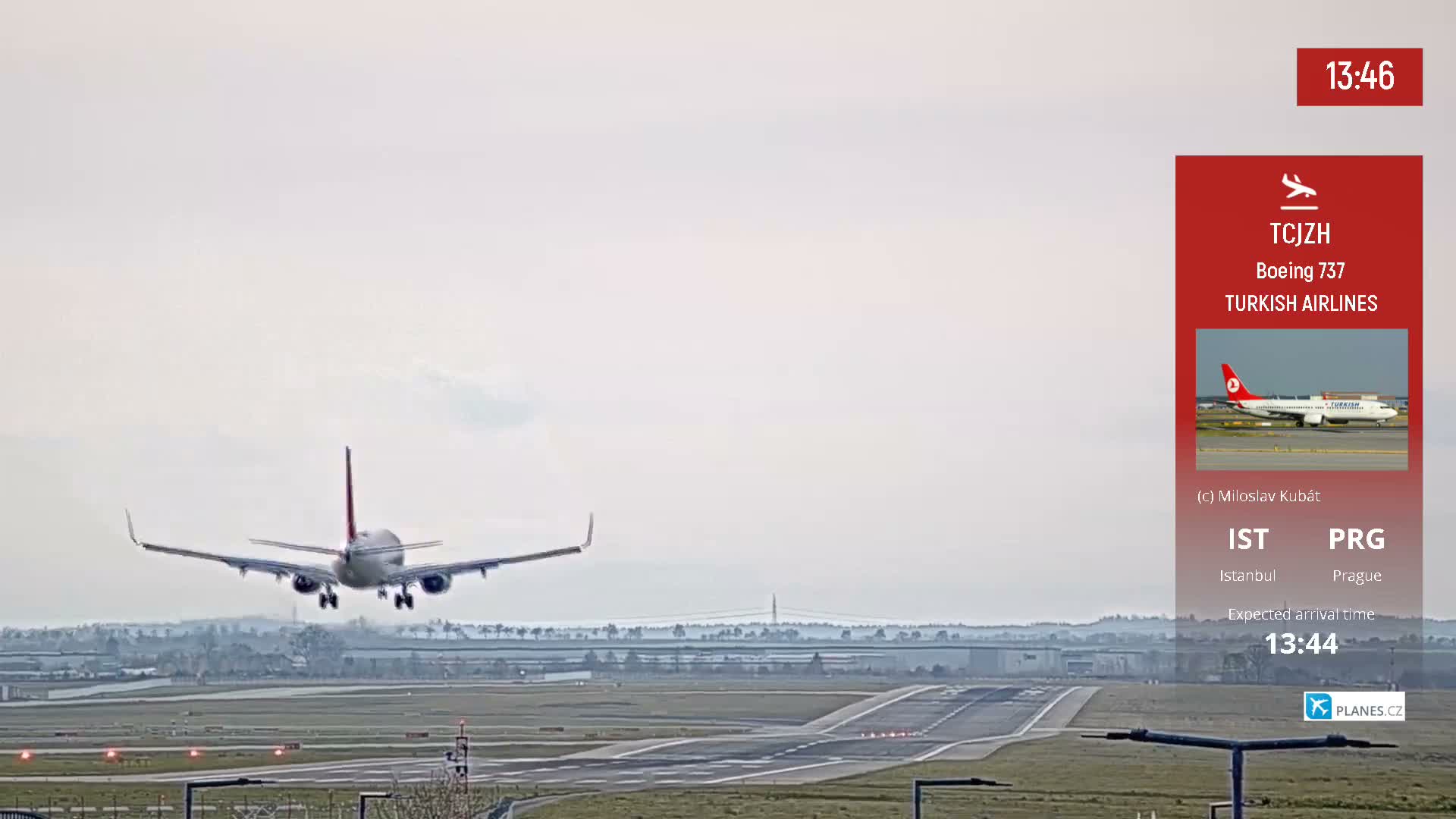A mostly cloudy sky hangs over an airport runway where construction equipment is visible and a Ryanair Boeing 737 is preparing for departure.