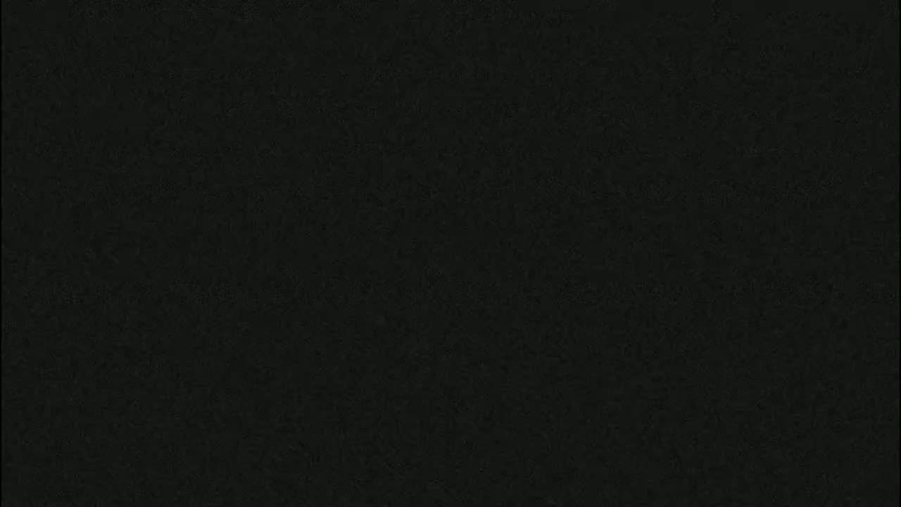 The image shows a dark, textured surface.