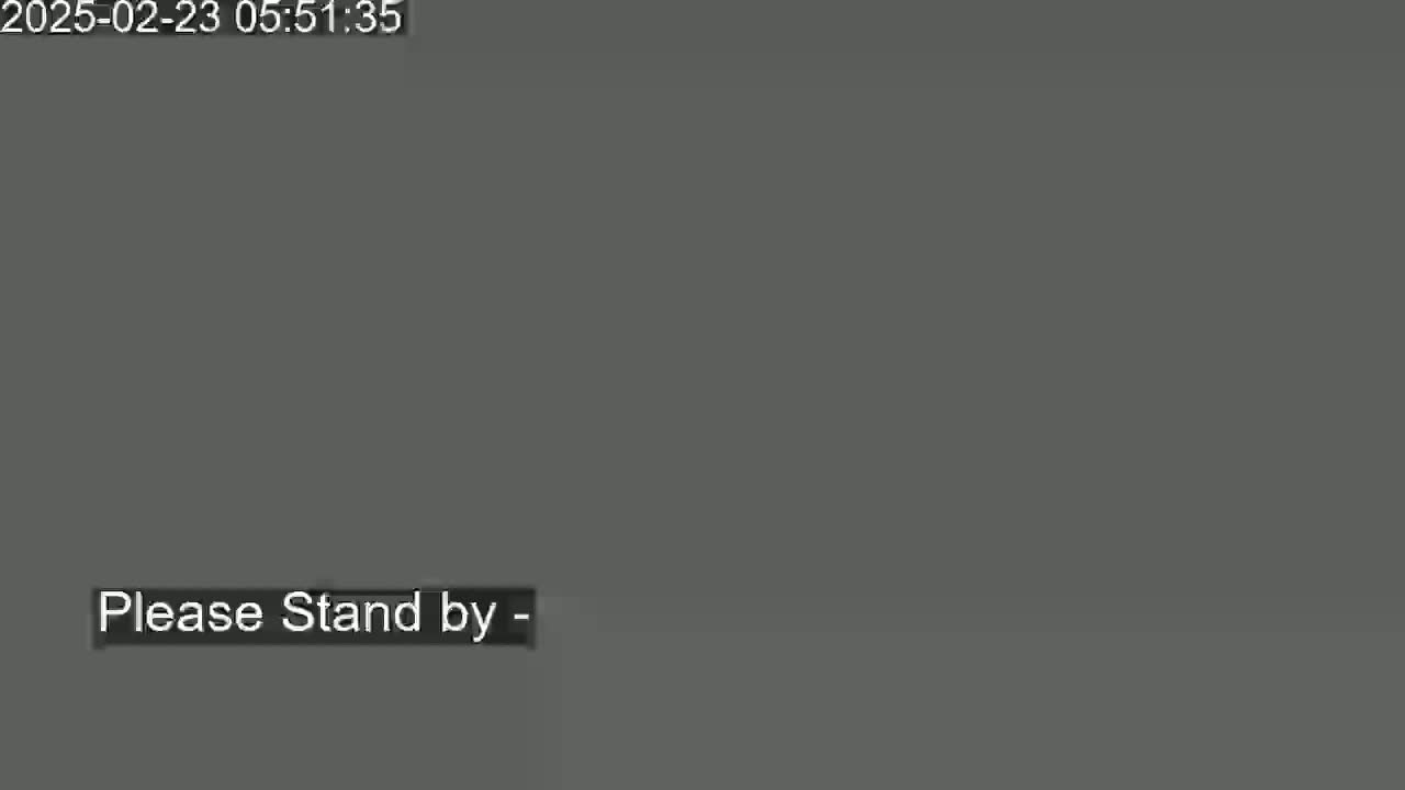 The image is a solid dark grey screen with the words "Please Stand by" in a smaller, lighter grey box near the bottom.