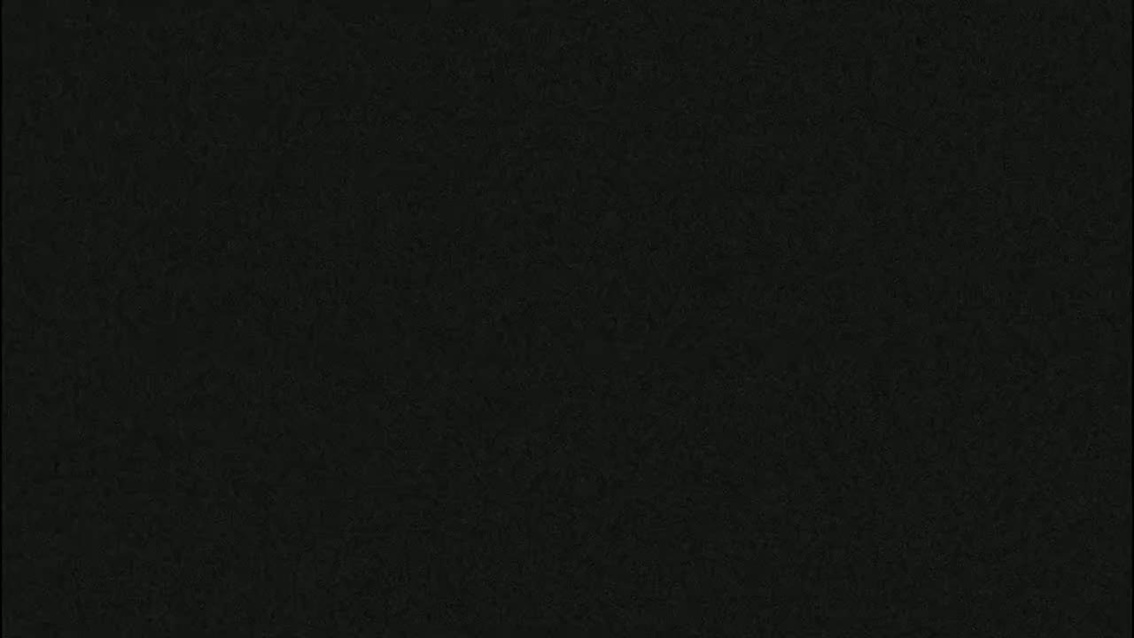 The image is a solid dark-grey/black field of indistinct texture.
