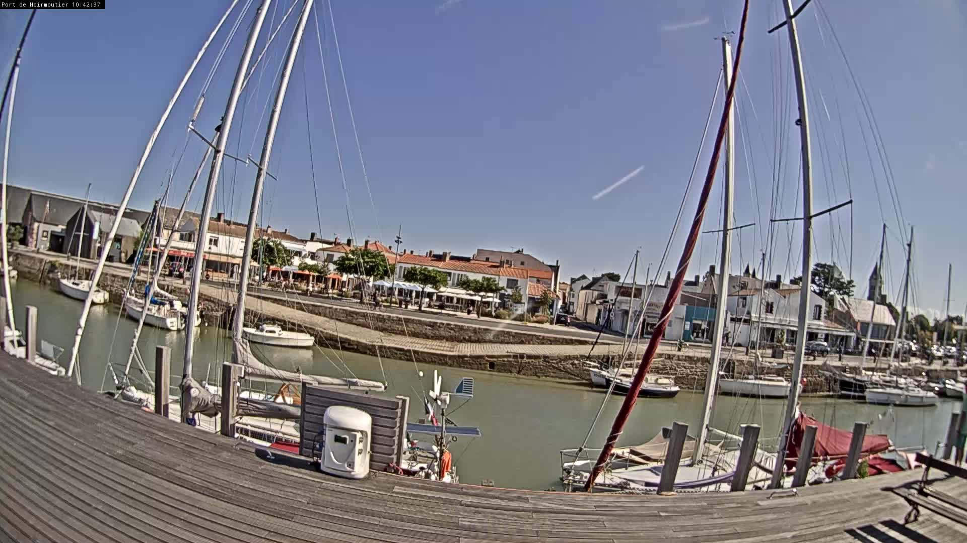 A marina filled with sailboats on a sunny day.