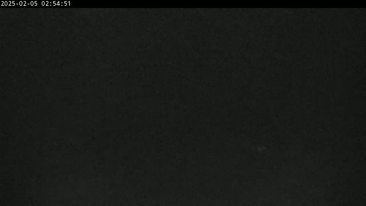 A dark, possibly nighttime image shows a uniformly black surface.