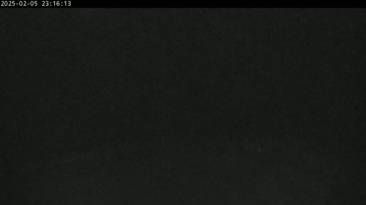 A completely dark image, possibly nighttime, with a slightly grainy texture.