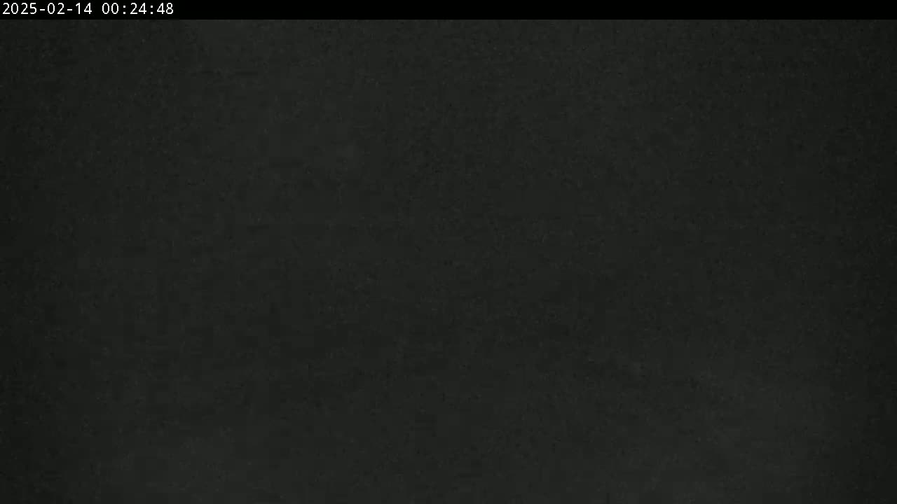 The image shows a uniformly dark gray or black surface.