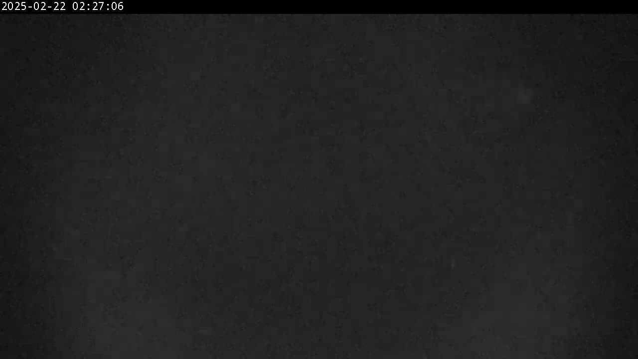 The image shows a uniformly dark gray or black surface with subtle texture.
