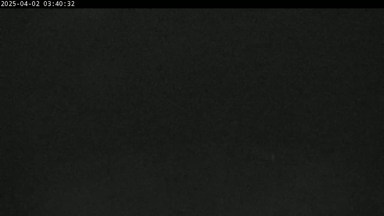 A dark, uniformly textured image is visible, possibly depicting nighttime conditions.