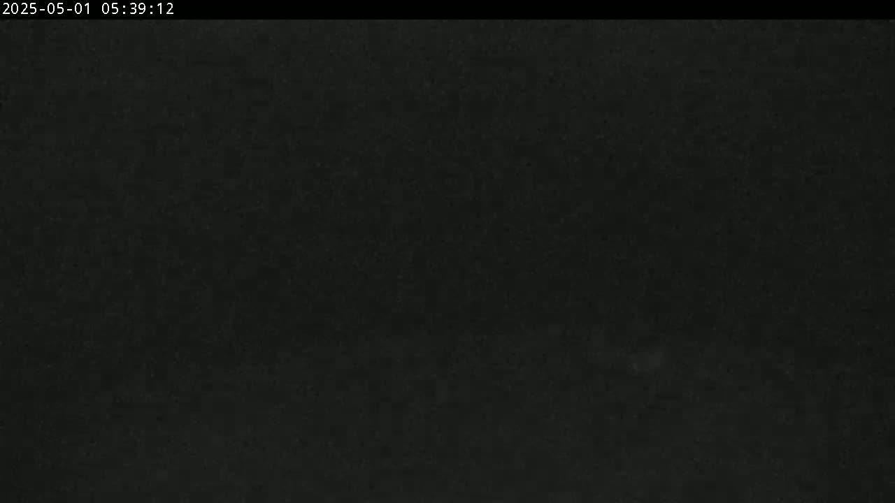 A dark, grainy image shows a completely black scene.
