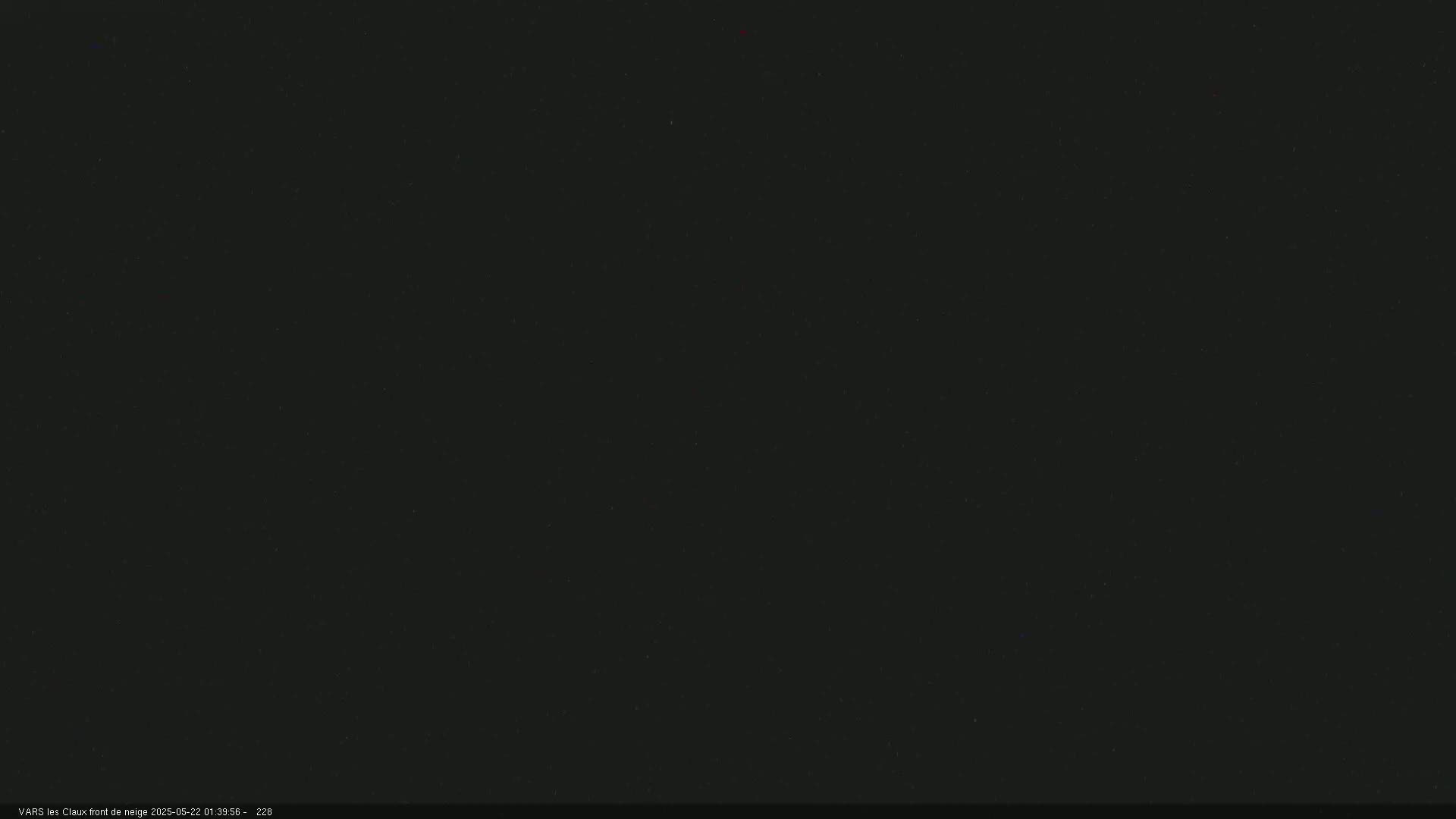 The image is a completely black screen with some slight variations in shade.