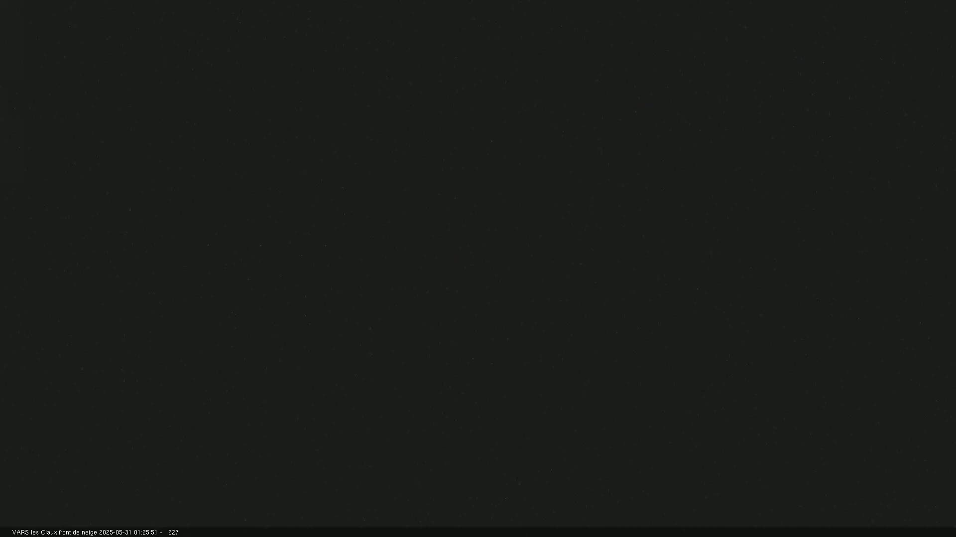 The image shows a uniformly dark gray or black screen with slight noise or grain.