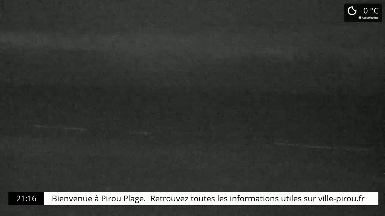 A dark, nighttime scene of a beach with a temperature of 0°C.