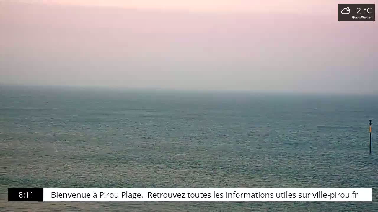 A hazy, calm ocean is shown under a pale sky with a temperature of -2°C.