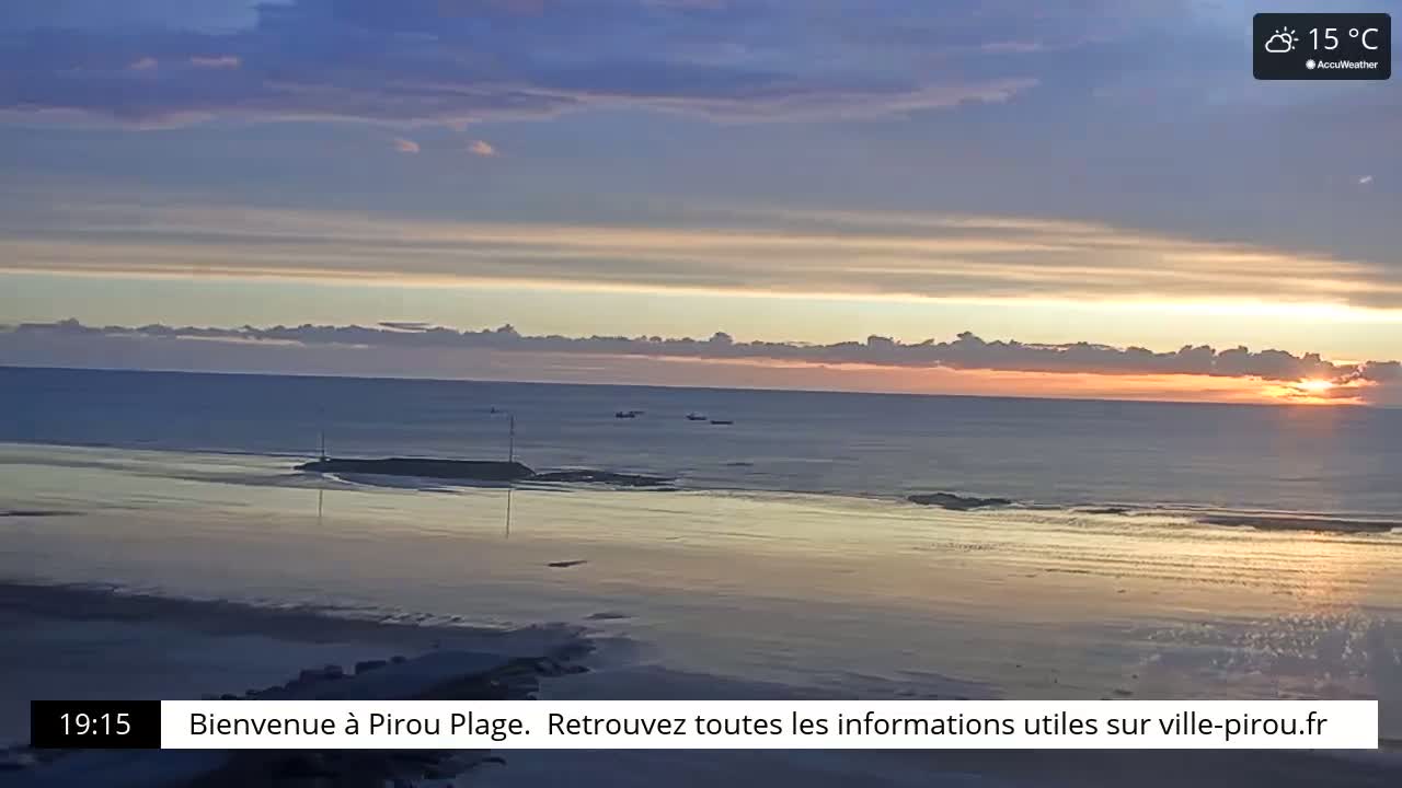 A calm ocean at sunset reflects the warm colors of the sky under partly cloudy conditions.