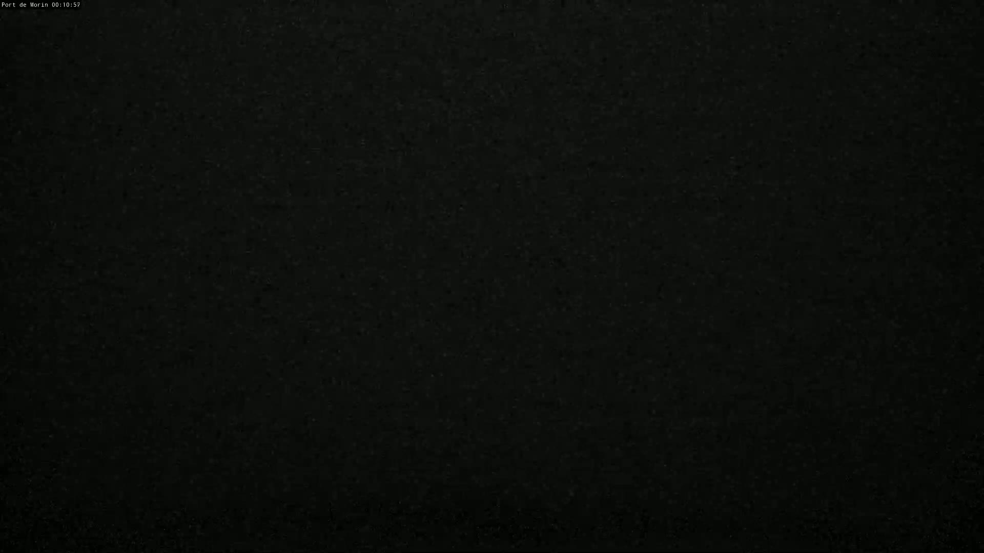 The image shows a completely dark, grainy surface.