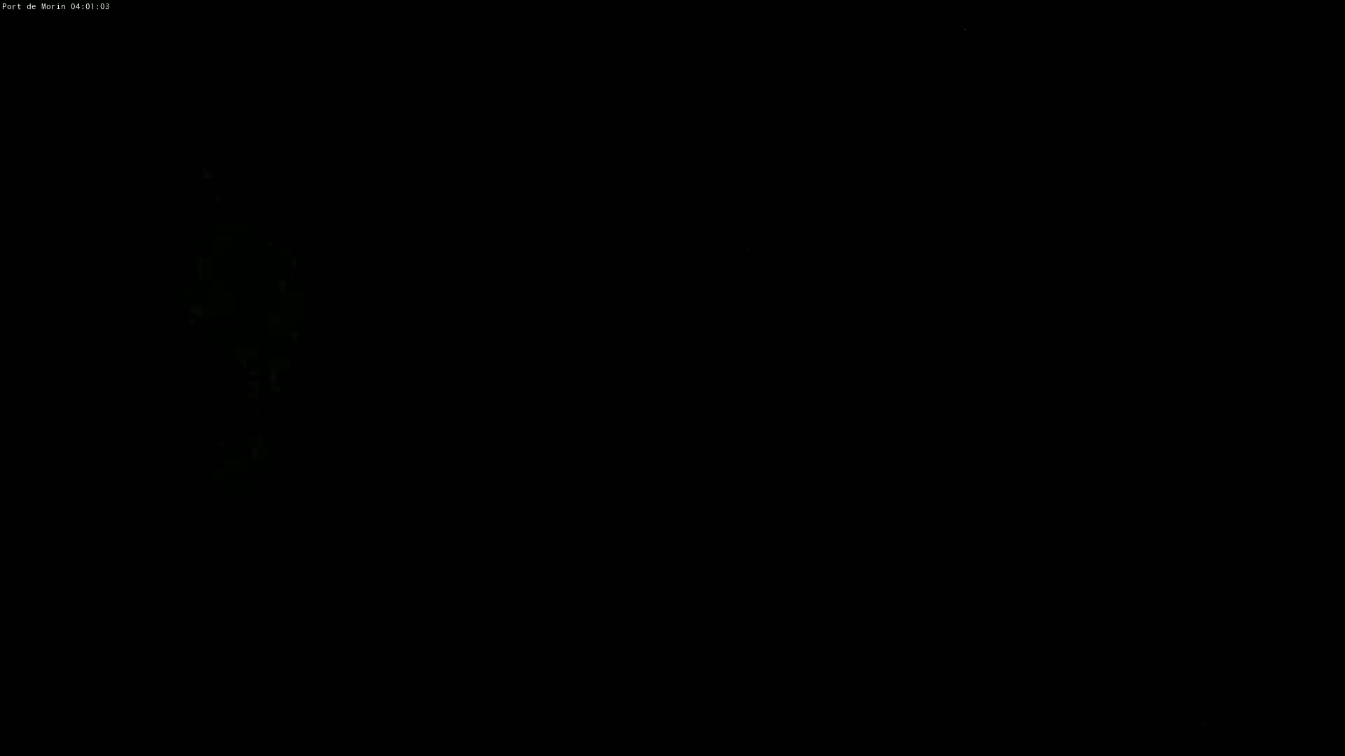 A mostly black image shows a faint, indistinct, greenish-white vertical shape in the left third of the frame.