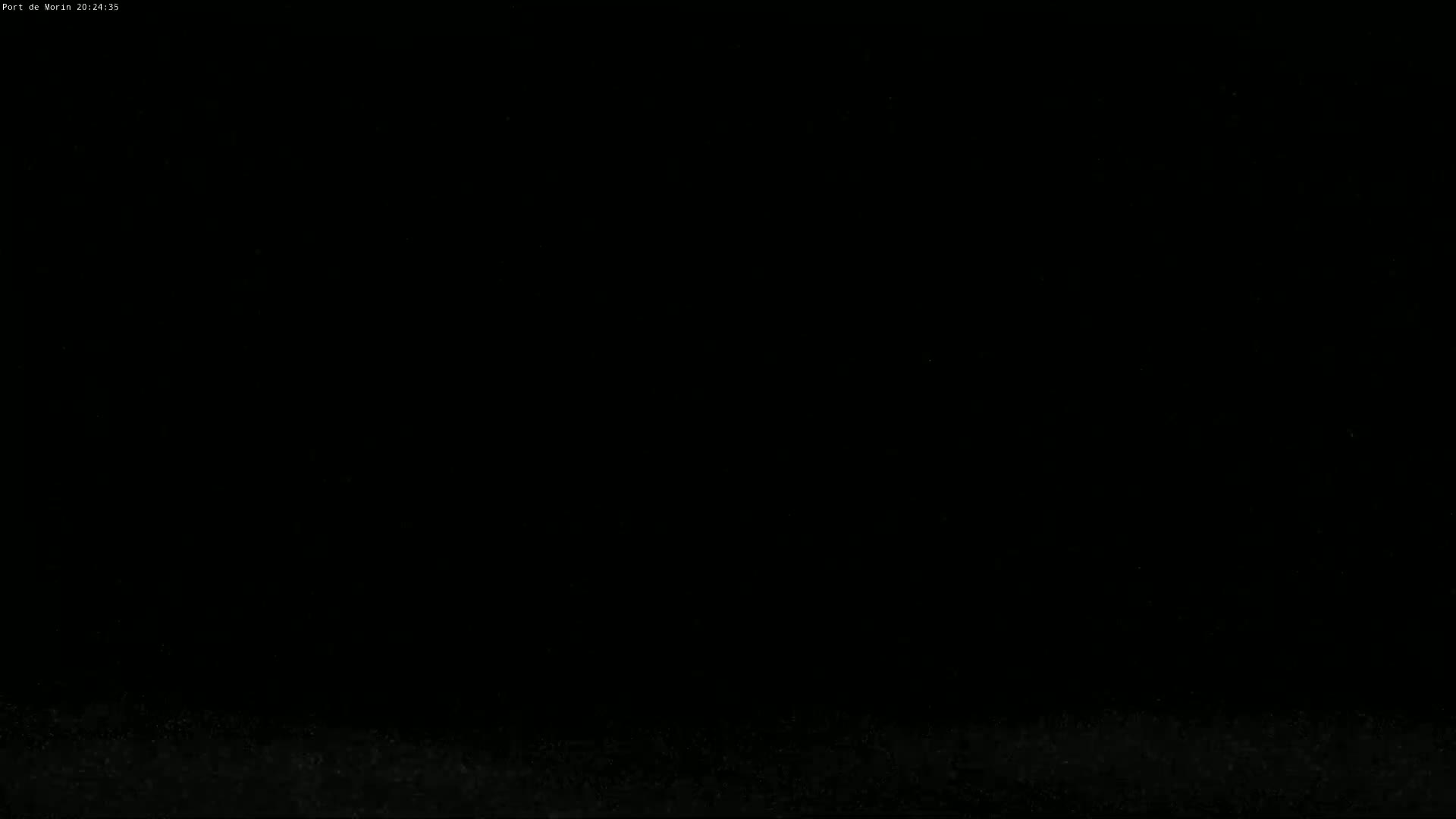 The image is completely black except for some faint speckling near the bottom.