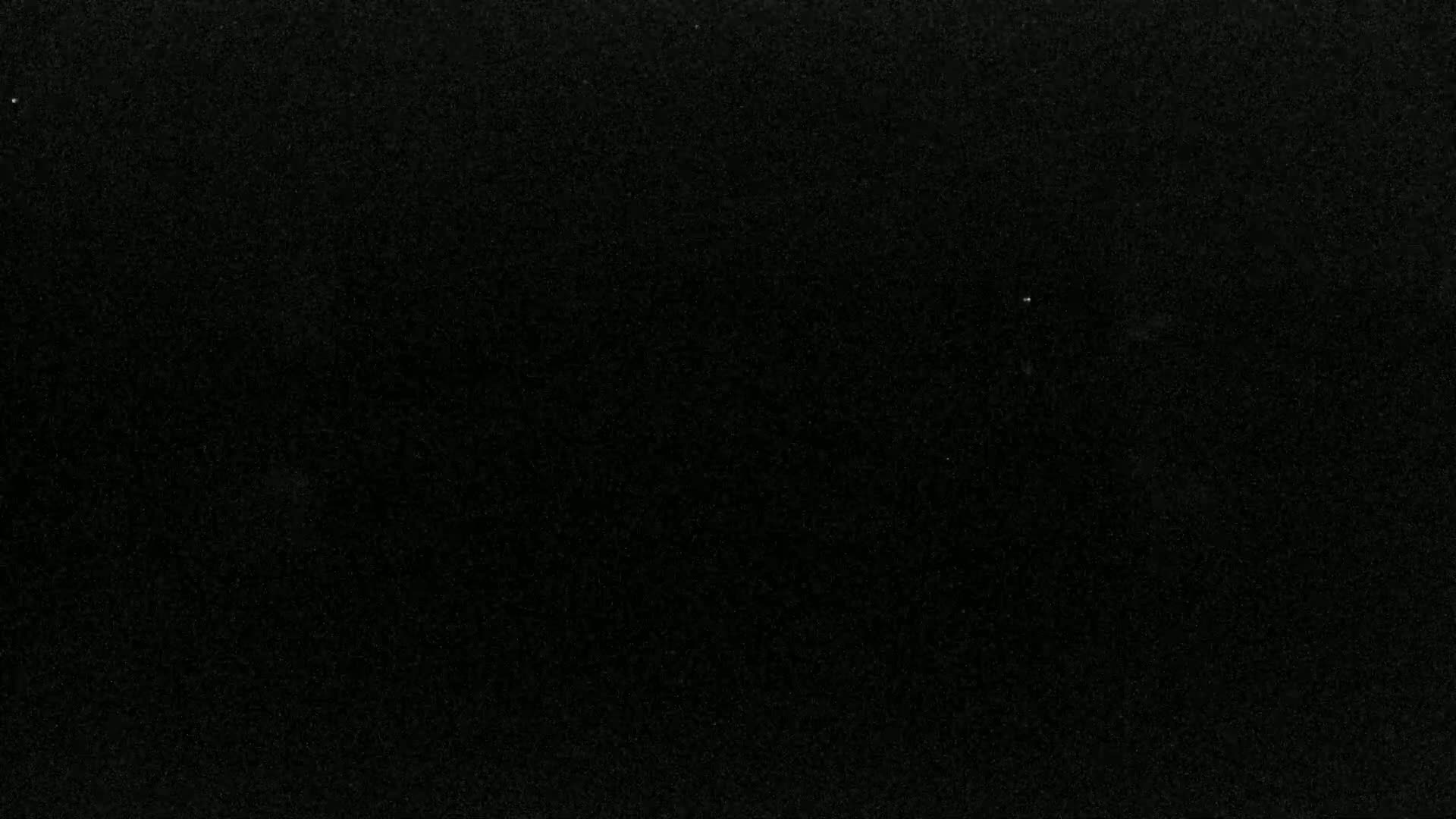 The image shows a completely black surface with a slightly grainy texture.