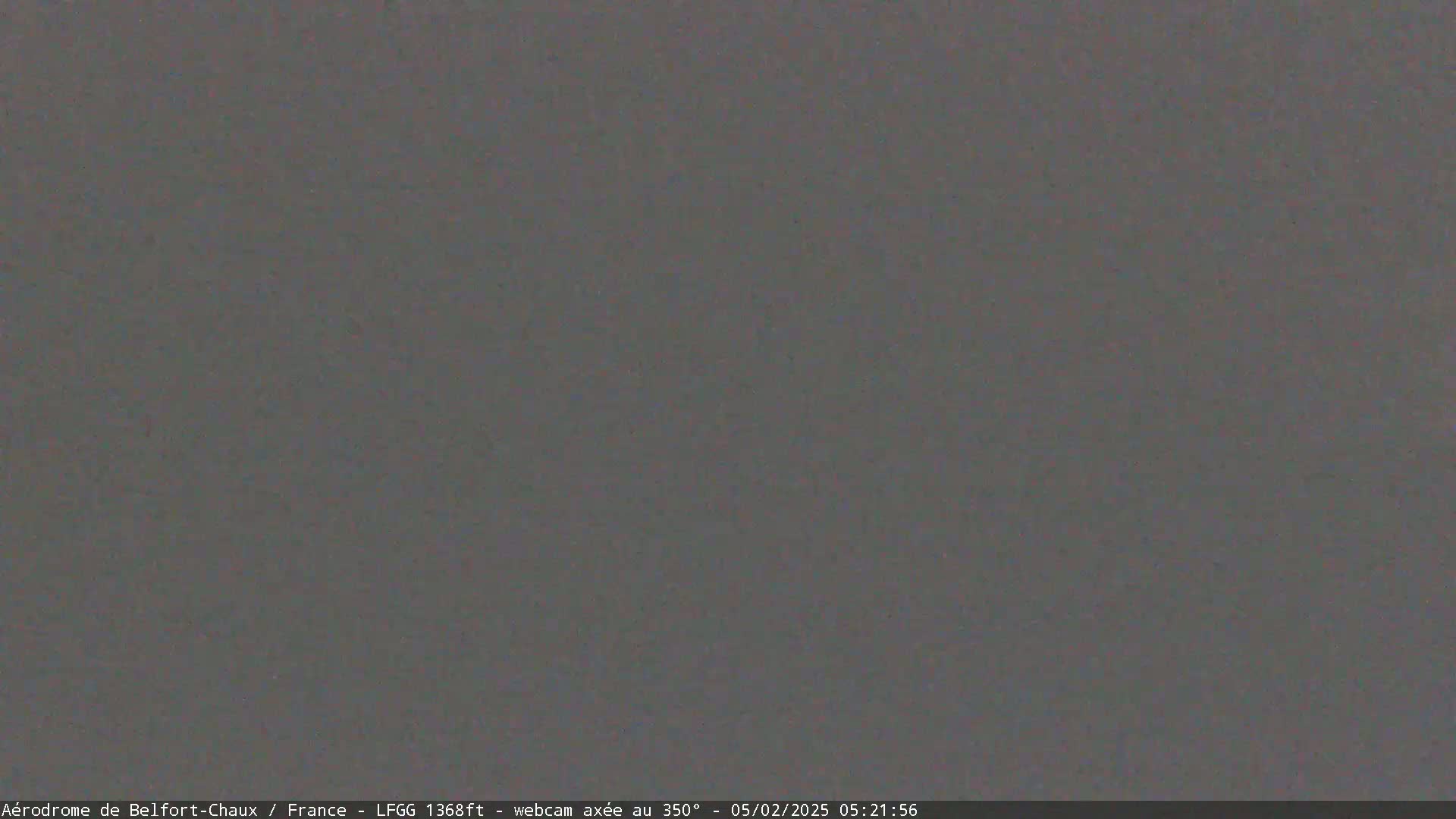 A uniformly dark gray image shows no discernible features.