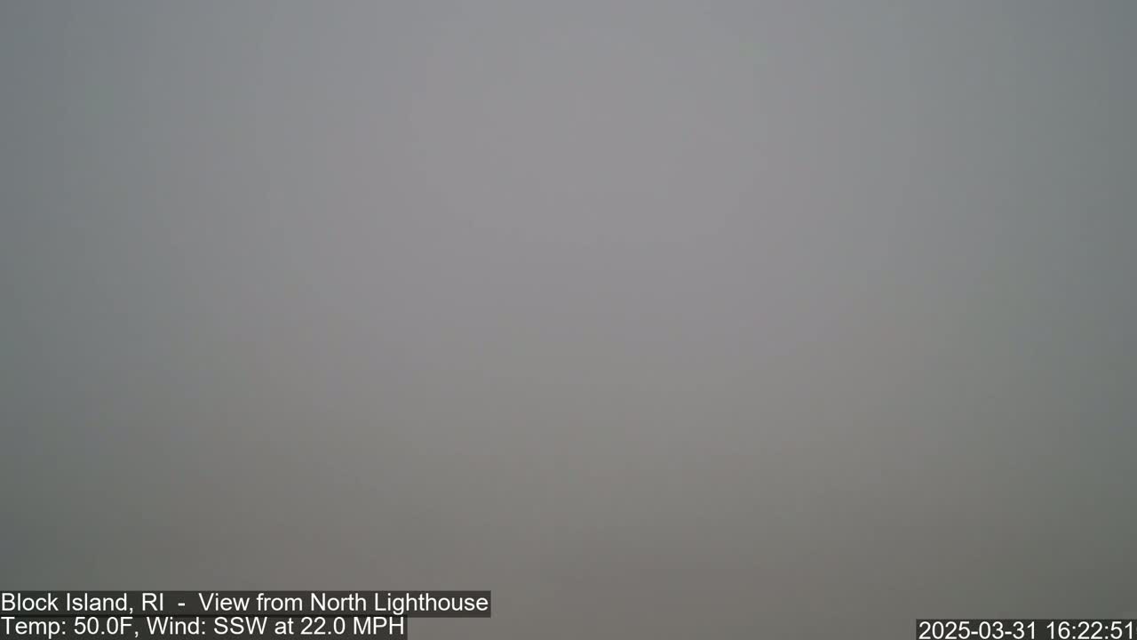 A foggy, gray scene is visible with a 50°F temperature and a 22 mph south-southwesterly wind.