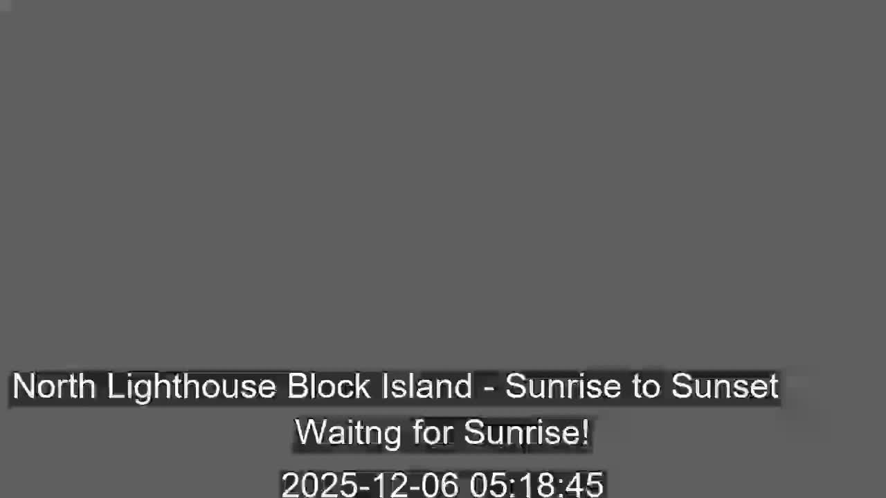 The image displays a solid dark grey screen, indicating nighttime conditions before sunrise.