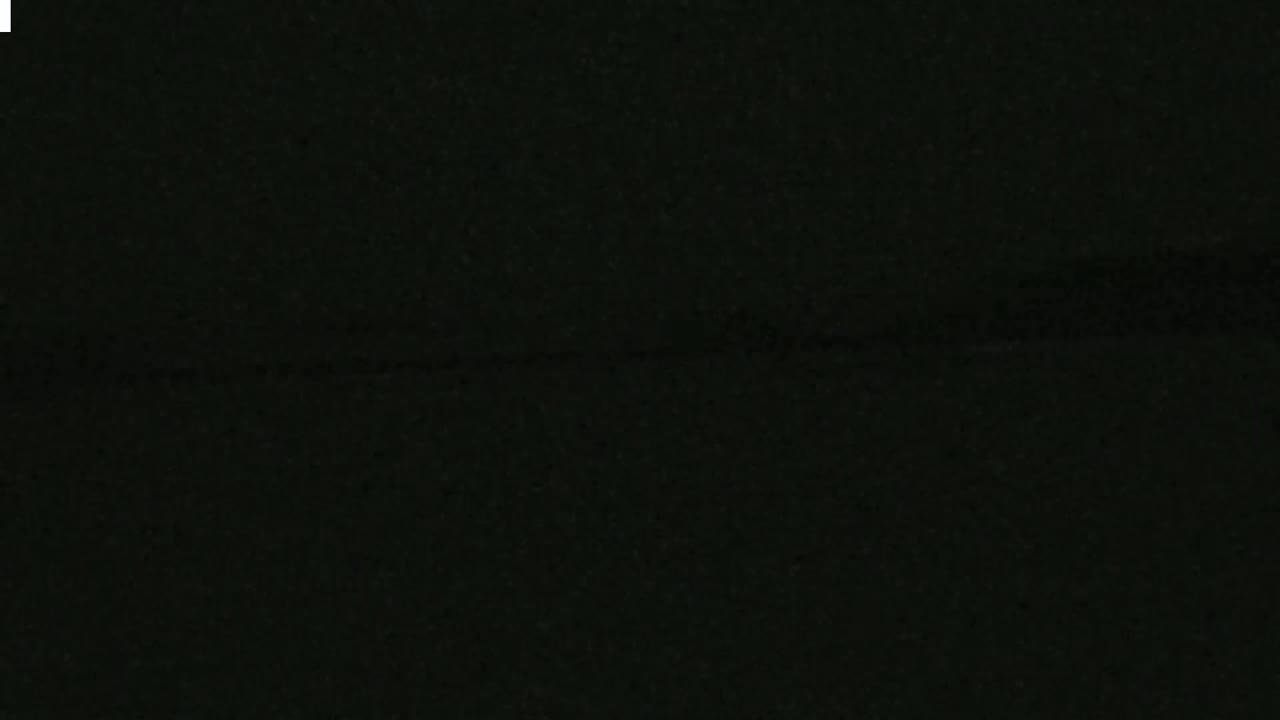 The image shows a uniformly dark, textured surface.