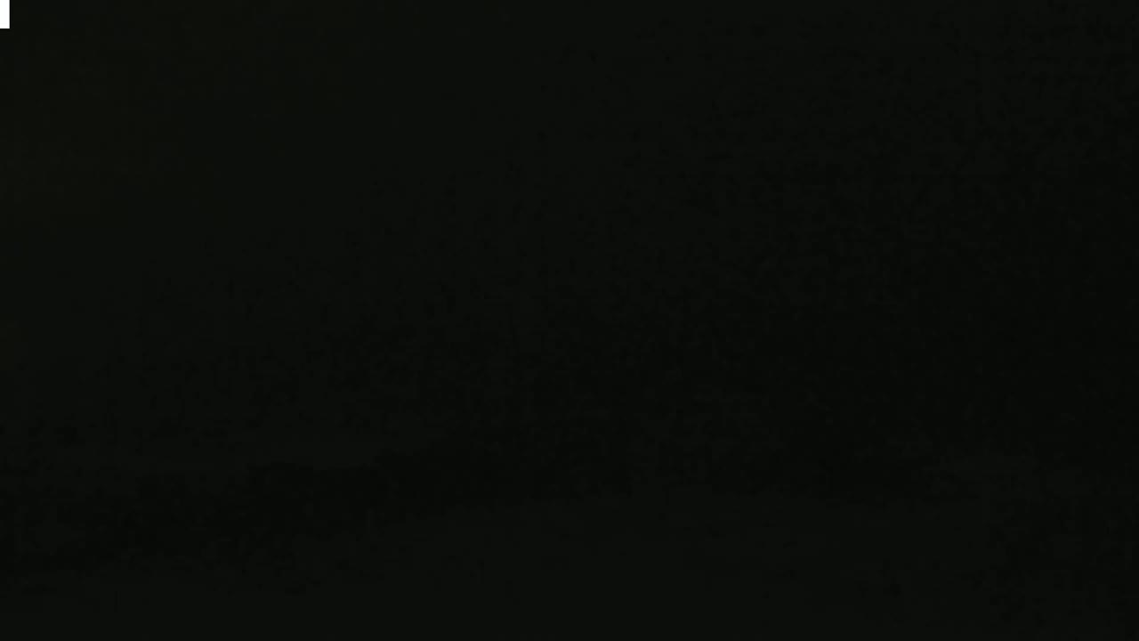 The image is entirely black with a slightly grainy texture.