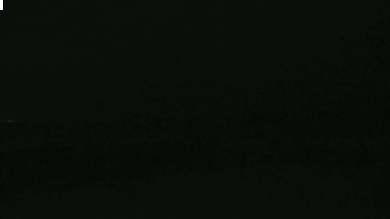 The image shows a completely black, grainy screen.