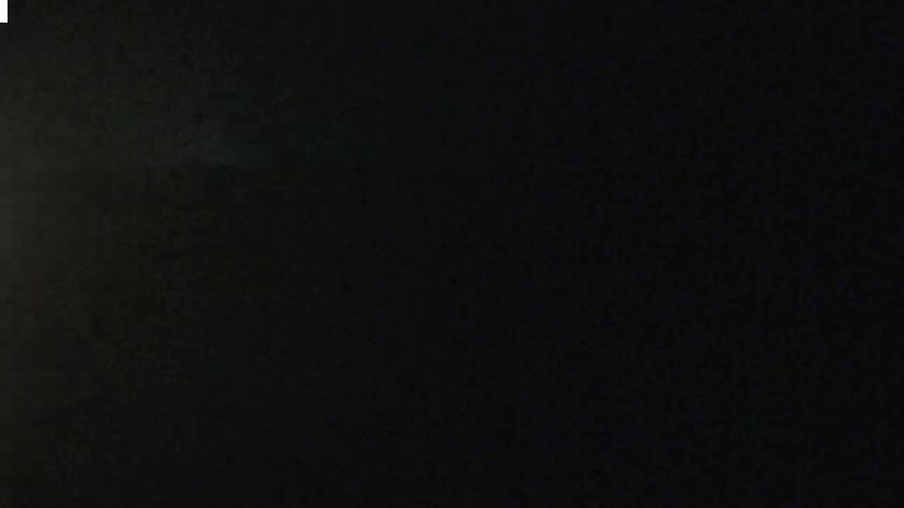 The image shows a completely black, textured surface.