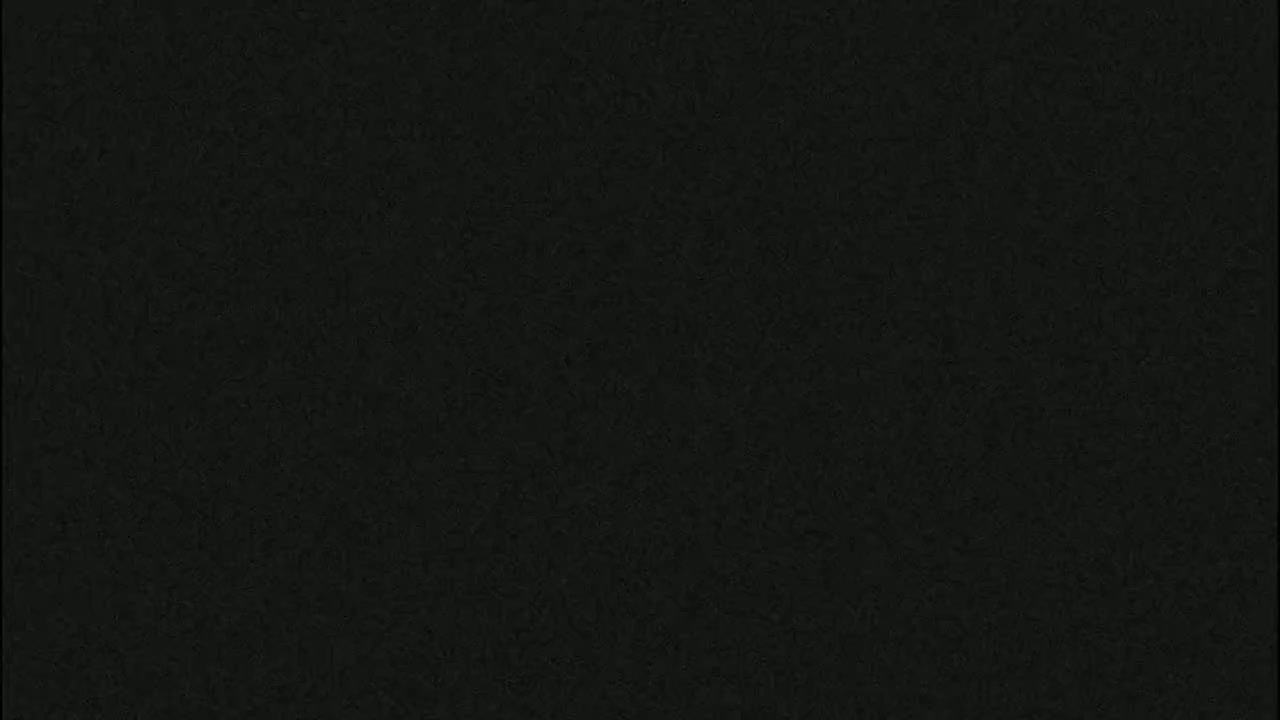 The image shows a dark, textured surface.