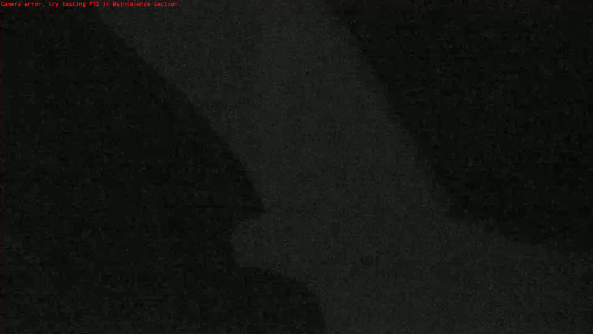 The image shows a grainy, dark view with indistinct shapes.