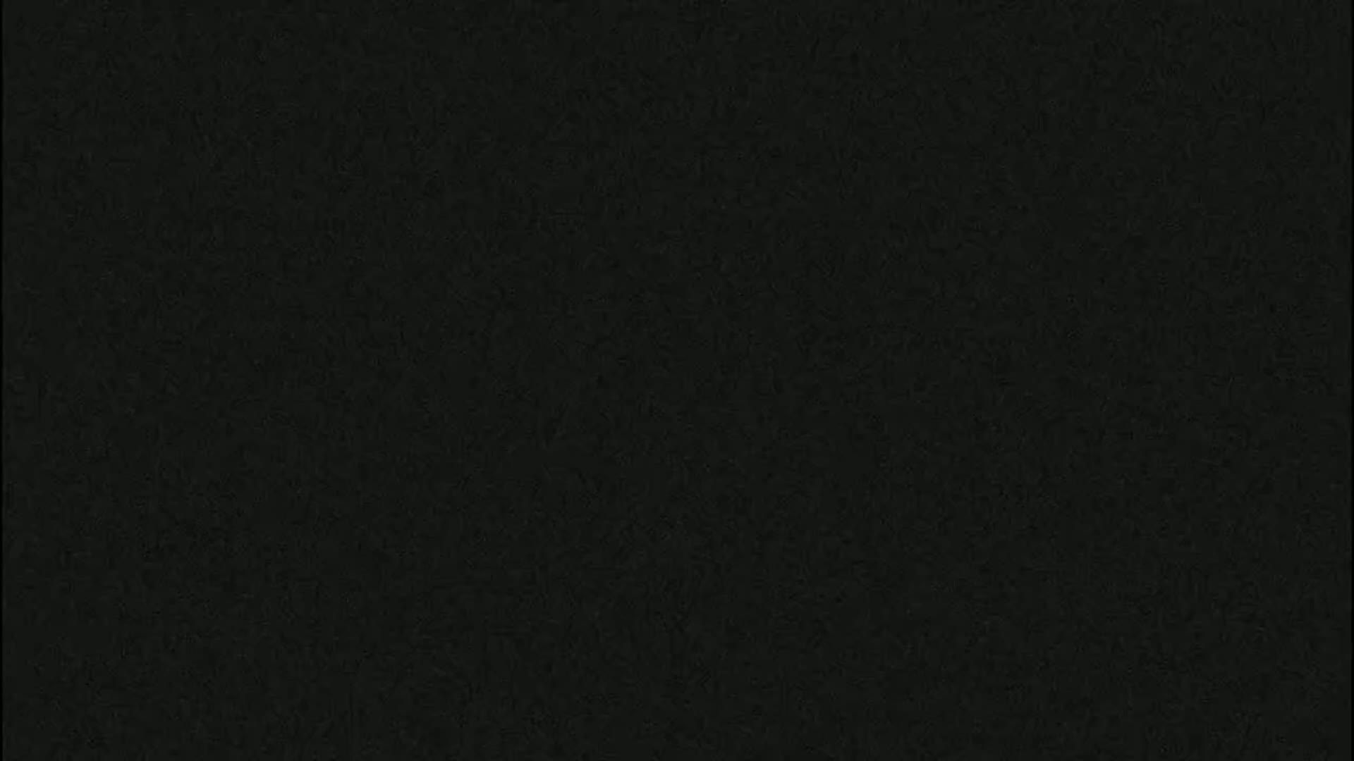 The image shows a uniformly dark gray-black textured surface.