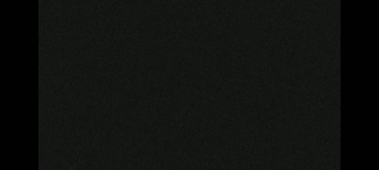 The image shows a dark-grey textured background.