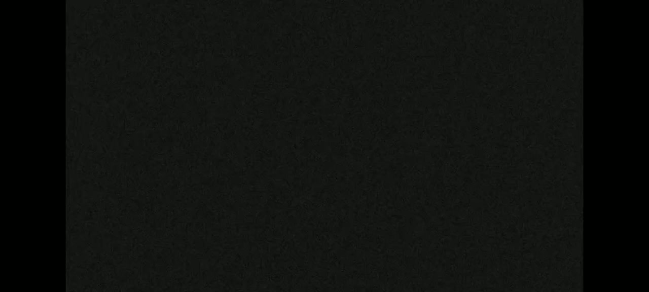 The image shows a dark-colored textured surface.
