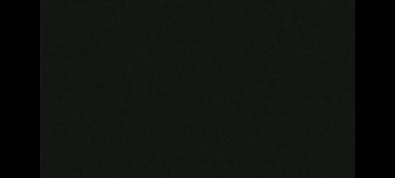 The image is a dark-green textured surface.
