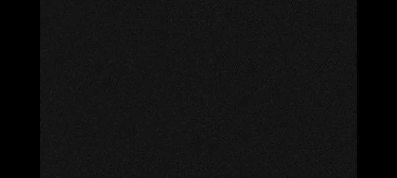 The image shows a dark gray textured surface.